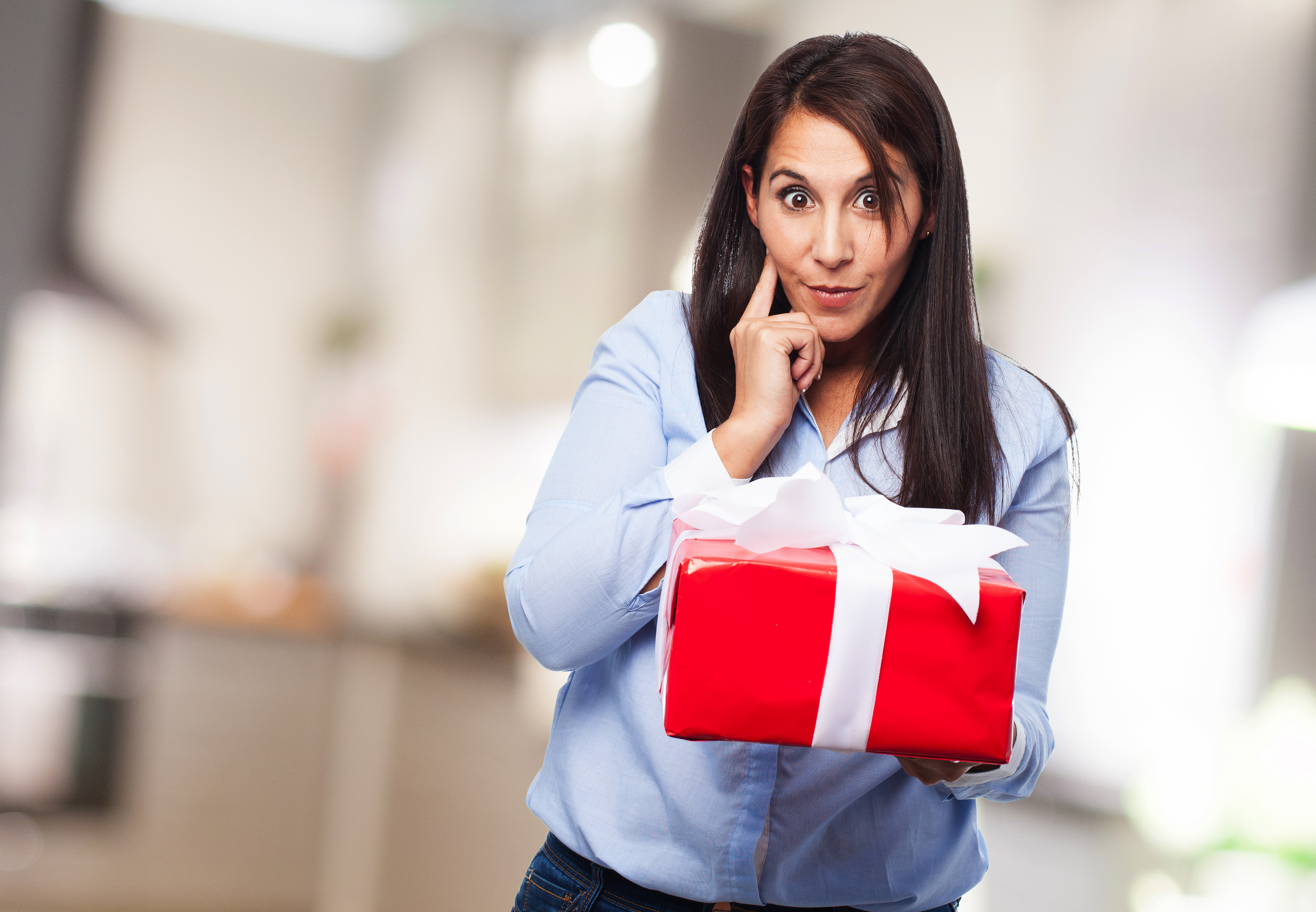 thoughtful-woman-with-red-gift